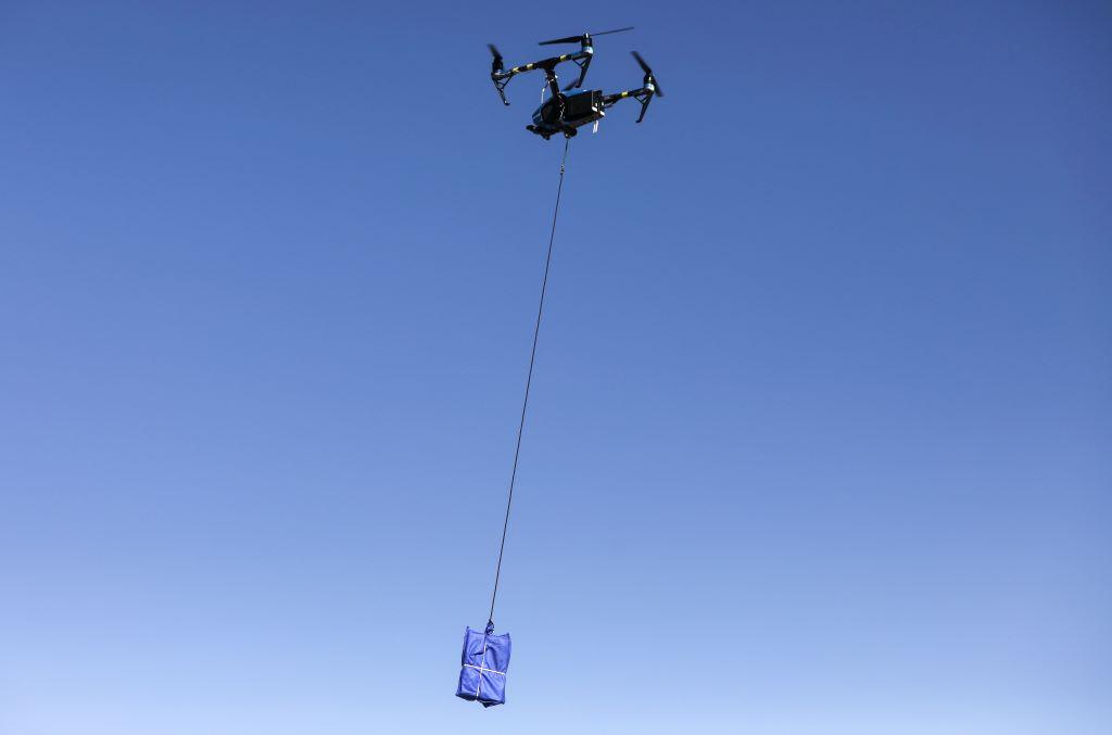 A test flight is flown by a DroneUp pilot in preparation for drone delivery of Covid-19 home self-collection kits from Walmart amid a Covid-19 surge in El Paso in 2020, in El Paso, Texas. Residents who lived within 1.5 miles of the Walmart Supercenter in East El Paso were eligible for the free kits as part of a drone delivery pilot program. Credit: Photo by Mario Tama/Getty Images